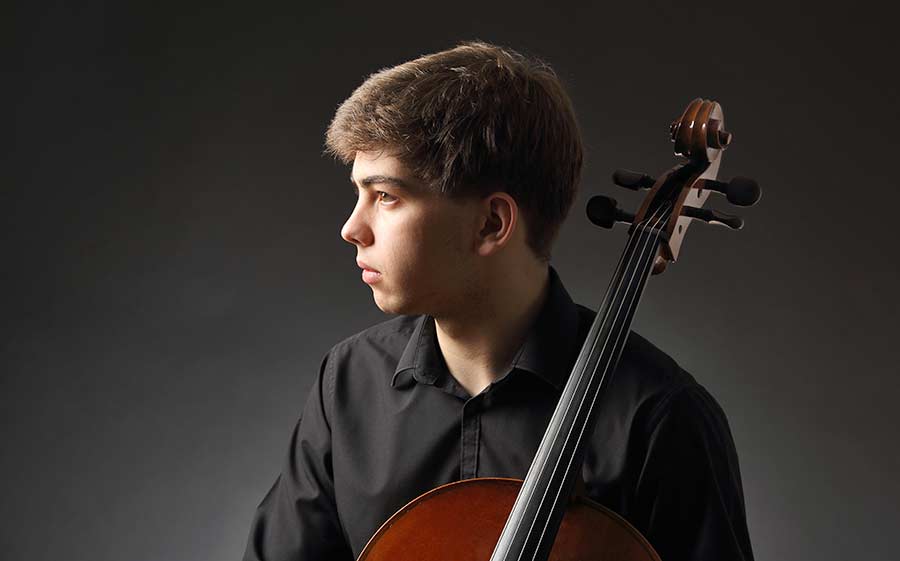 studio photo of cellist